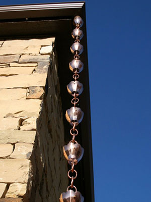 A rain chain can be placed on different places of your home to help move water away from your gutters & for decoration.