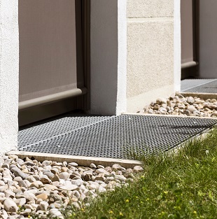 A surface french drain is a type of french drain that is installed at the ground level to remove water from low-lying areas.