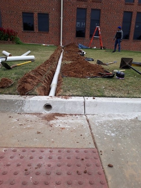 An underground drain will move rainwater from your building to the street with underground pipes that no one can see.